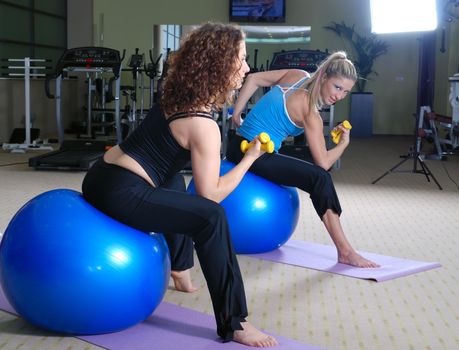 beautifull young girls working out in a gym