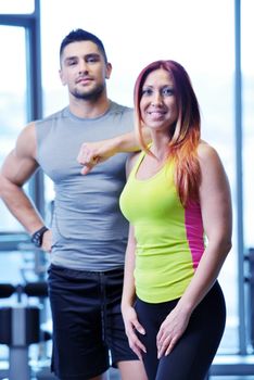 attractive couple at the gym looking happy