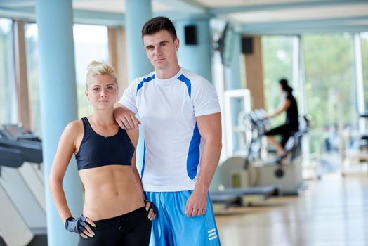 group portrait of healthy and fit young people in fitness gym