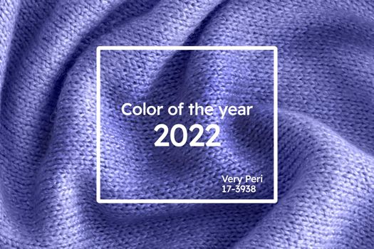 Color of the year 2022 soft knitted sweater texture closeup. Light violet blue abstract background. Trendy soft blue backdrop for web design. Luxury twisted fabric backplate