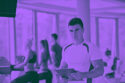 group portrait of healthy and fit young people in fitness gym duo tone