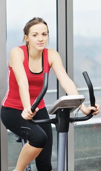 young woman exercise fitness and workout while run on track in sport club