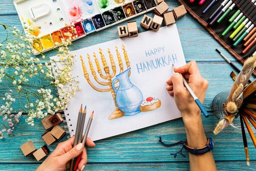 Top view of a watercolor art Happy Hanukkah, watercolor art, flat lay