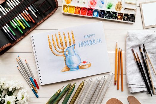 Top view of a watercolor art Happy Hanukkah, watercolor art, flat lay