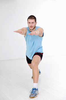 young man in fintess sport club exercise withweights and relaxing