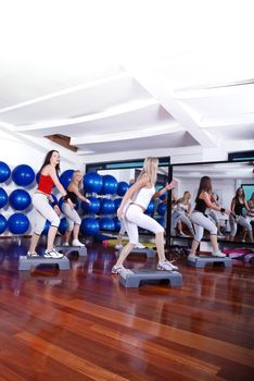 group of young girls stepping in fitness club