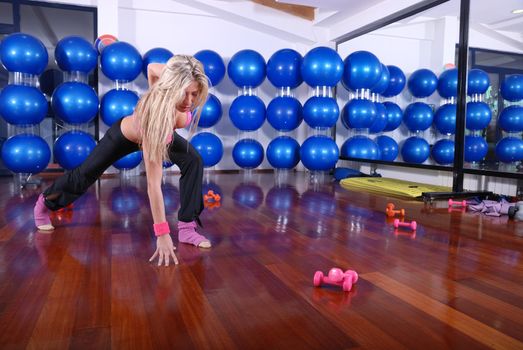 health club: women doing stretching, fitness, aerobics and yoga exercise