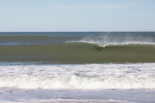 Approaching wave has just begun to break at Nags Head beach in North Carolina.