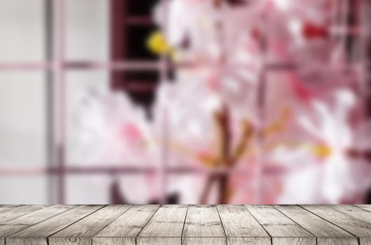 Empty top wooden table and flower blurred background. Can use for product display.