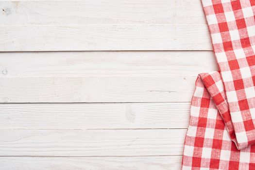 Red checkered tablecloth wooden background texture kitchen decoration. High quality photo