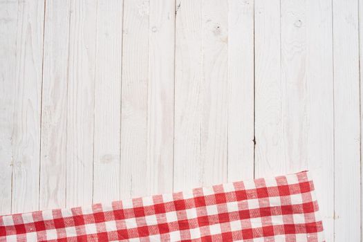 Red checkered tablecloth wooden background texture kitchen decoration. High quality photo