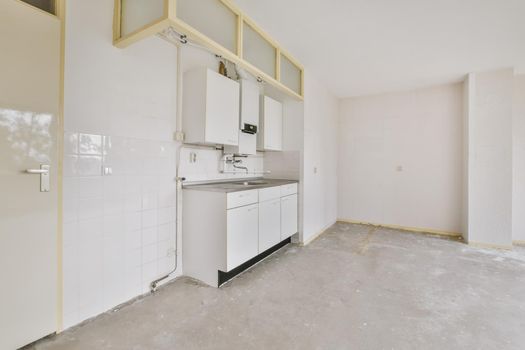 A cozy and spacious room with small kitchen
