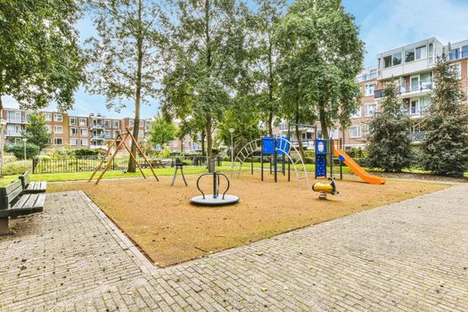 Delightful courtyard of the house with a playground and trees