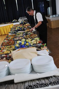 catering buffet food party preparation man