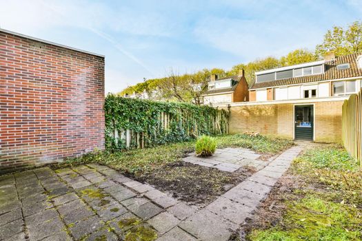 Delightful courtyard of a lovely home with a fence