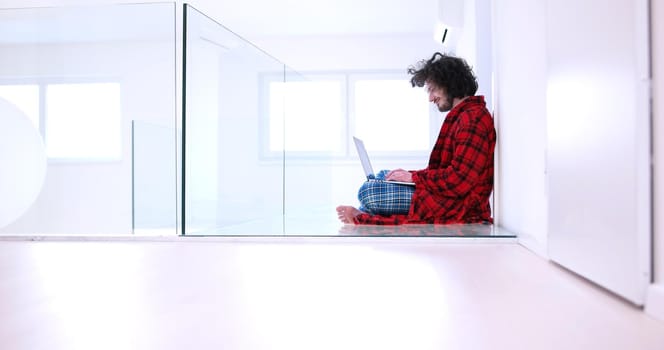 Real man Using laptop on the floor At Home  Enjoying Relaxing