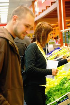 happy young couple in shopping