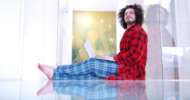 Real man Using laptop on the floor At Home  Enjoying Relaxing