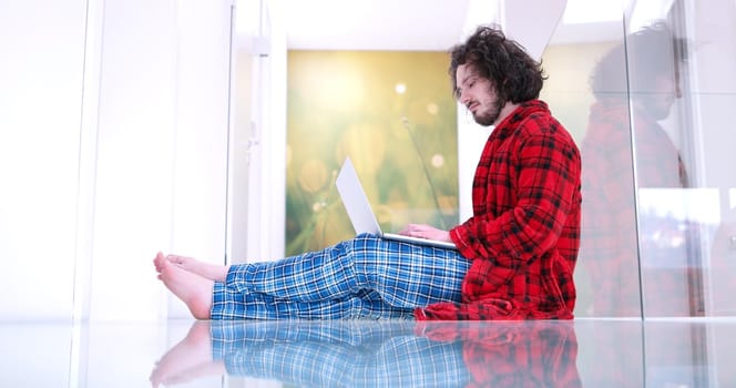 Real man Using laptop on the floor At Home  Enjoying Relaxing