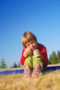      happy girl eating healthy food in nature                               