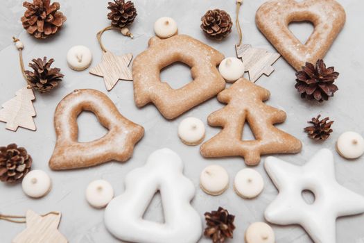 Banner for Christmas and New Year gingerbread stars, houses, Christmas trees, toys on a gray concrete background