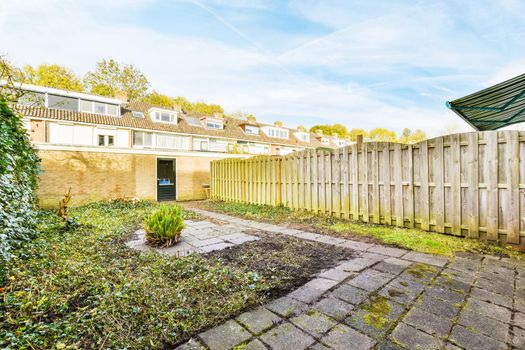 Delightful courtyard of a lovely home with a fence