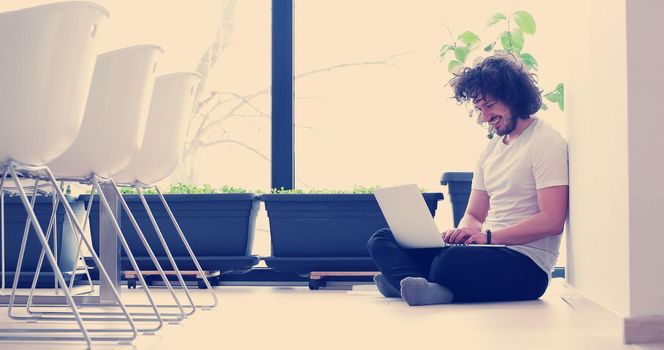 Real man Using laptop on the floor At Home  Enjoying Relaxing