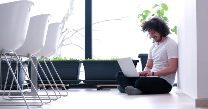 Real man Using laptop on the floor At Home  Enjoying Relaxing