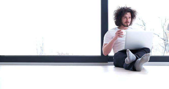 Real man Using laptop on the floor At Home  Enjoying Relaxing