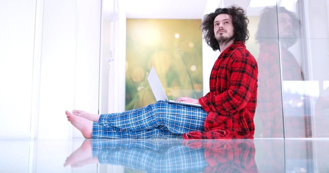 Real man Using laptop on the floor At Home  Enjoying Relaxing