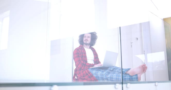 Real man Using laptop on the floor At Home  Enjoying Relaxing