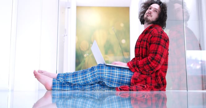 Real man Using laptop on the floor At Home  Enjoying Relaxing