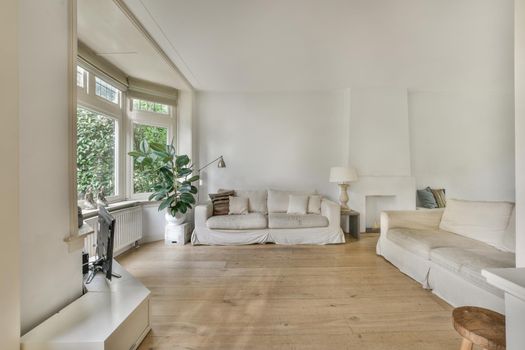 Stylish interior design of living room with modern sofa