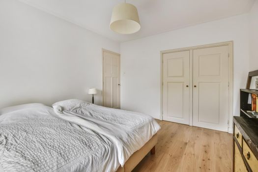 Beautiful bedroom in new luxury home with large bed