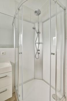 Modern shower stall in a bright bathroom