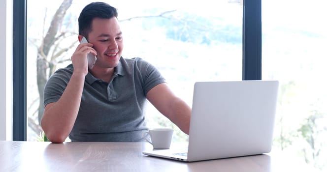 Young Entrepreneur Freelancer Working Using A Laptop In Coworking space