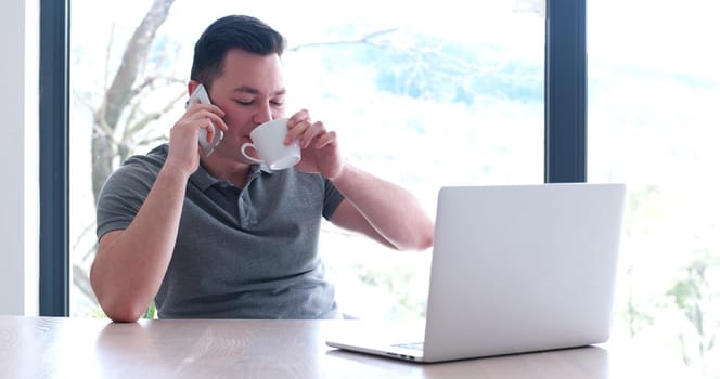 Young Entrepreneur Freelancer Working Using A Laptop In Coworking space