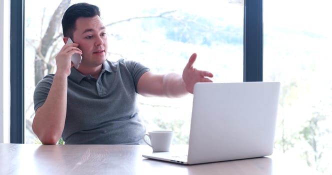 Young Entrepreneur Freelancer Working Using A Laptop In Coworking space