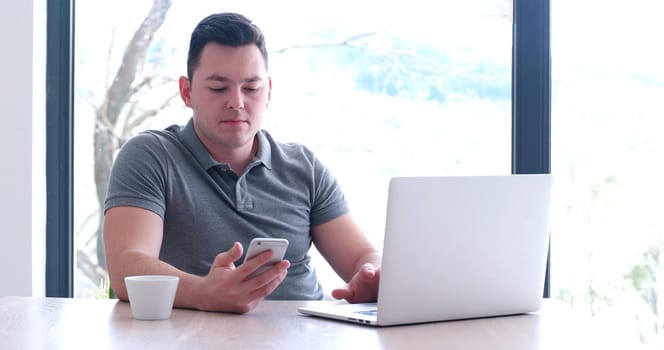 Young Entrepreneur Freelancer Working Using A Laptop In Coworking space