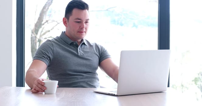 Young Entrepreneur Freelancer Working Using A Laptop In Coworking space