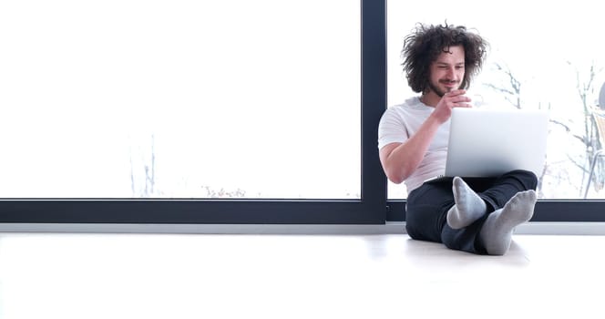 Real man Using laptop on the floor At Home  Enjoying Relaxing