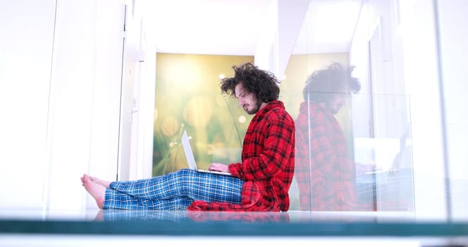 Real man Using laptop on the floor At Home  Enjoying Relaxing