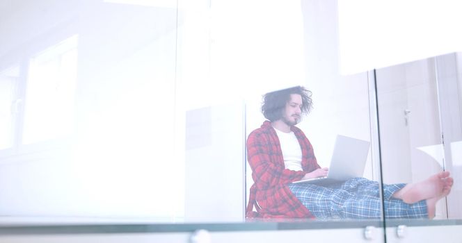 Real man Using laptop on the floor At Home  Enjoying Relaxing