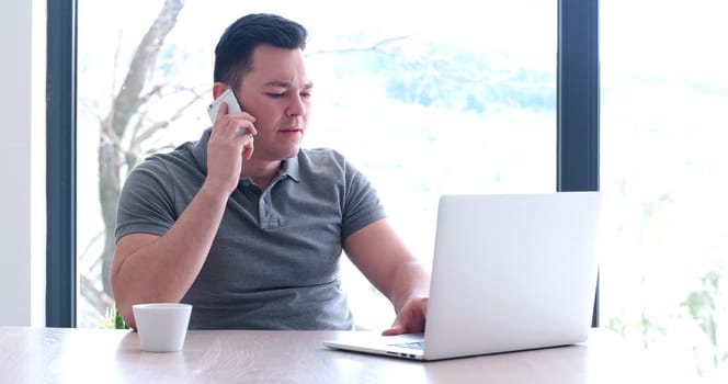 Young Entrepreneur Freelancer Working Using A Laptop In Coworking space