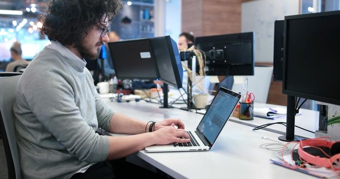 Young Entrepreneur Freelancer Working Using A Laptop In Coworking space