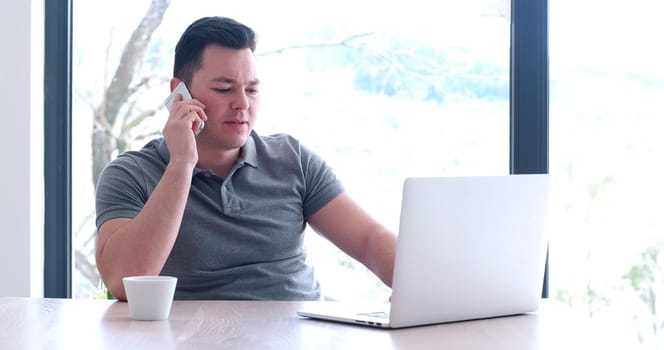 Young Entrepreneur Freelancer Working Using A Laptop In Coworking space