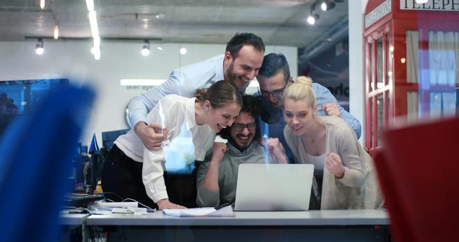 Group of a young business people discussing business plan at modern startup office building