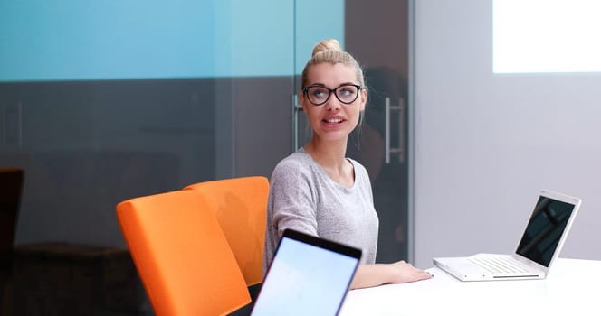 Young female Entrepreneur Freelancer Working Using A Laptop In Coworking space