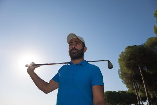 handsome middle eastern golf player portrait at course on beautiful sunset in backgeound