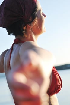 happy girl spreading hands and enjoy in sunlight at summer vacation